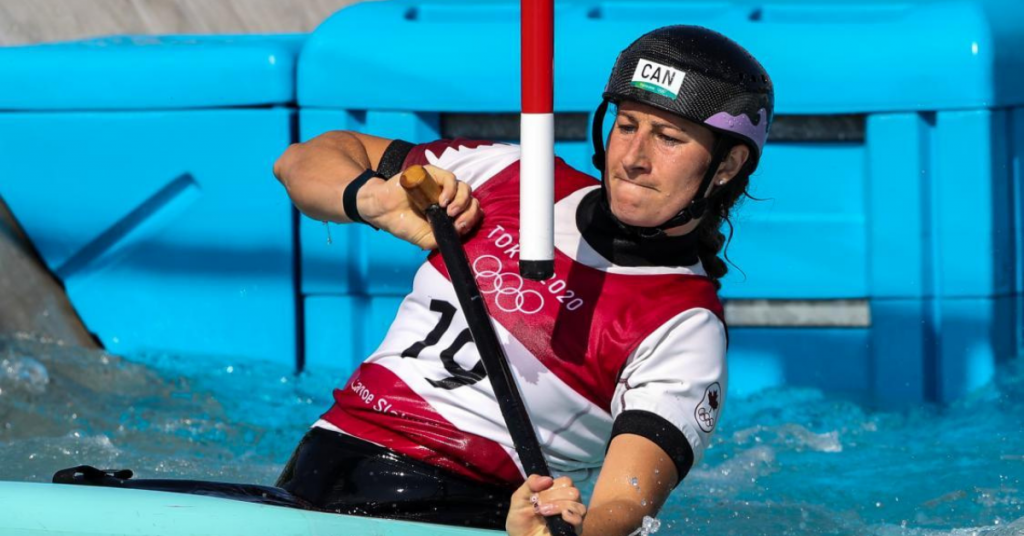 A woman kayaker competes in the Olympics.